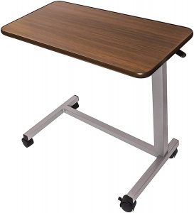 Vaunn Medical is an adjustable hospital tray table with wheel to place beside your bed for working or eating.