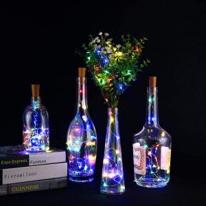 decorated wine bottles with lights inside