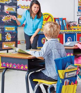 Kids sitting in classroom with teacher