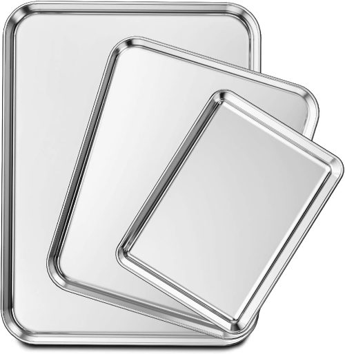 Three stainless steel baking sheets on display.